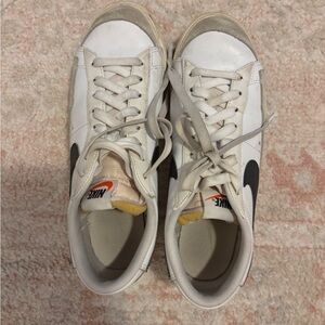 Nike White Sneakers with Black Swoosh and Yellow Tongue Accents